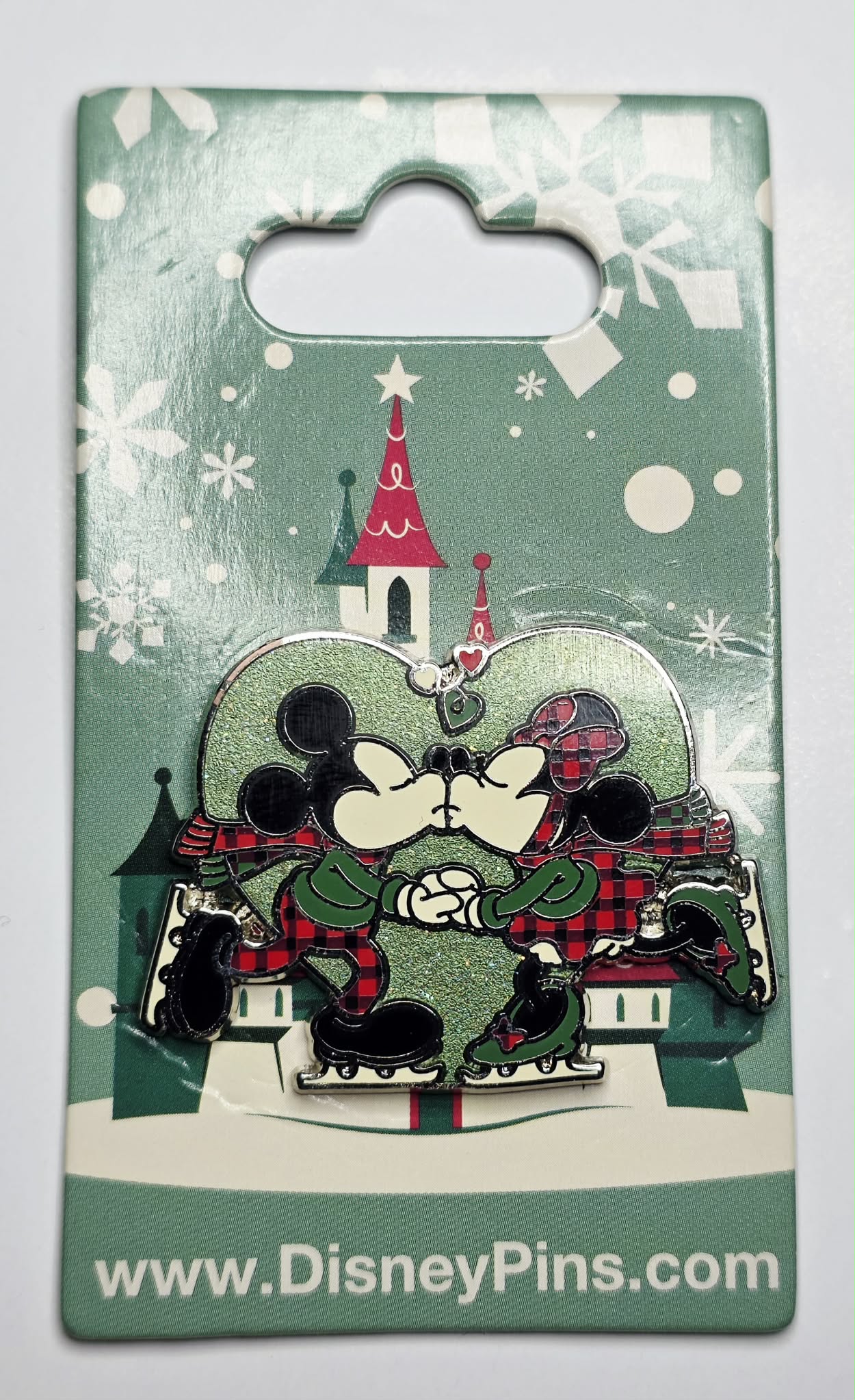 Mickey and Minnie Mouse ice skating and kissing