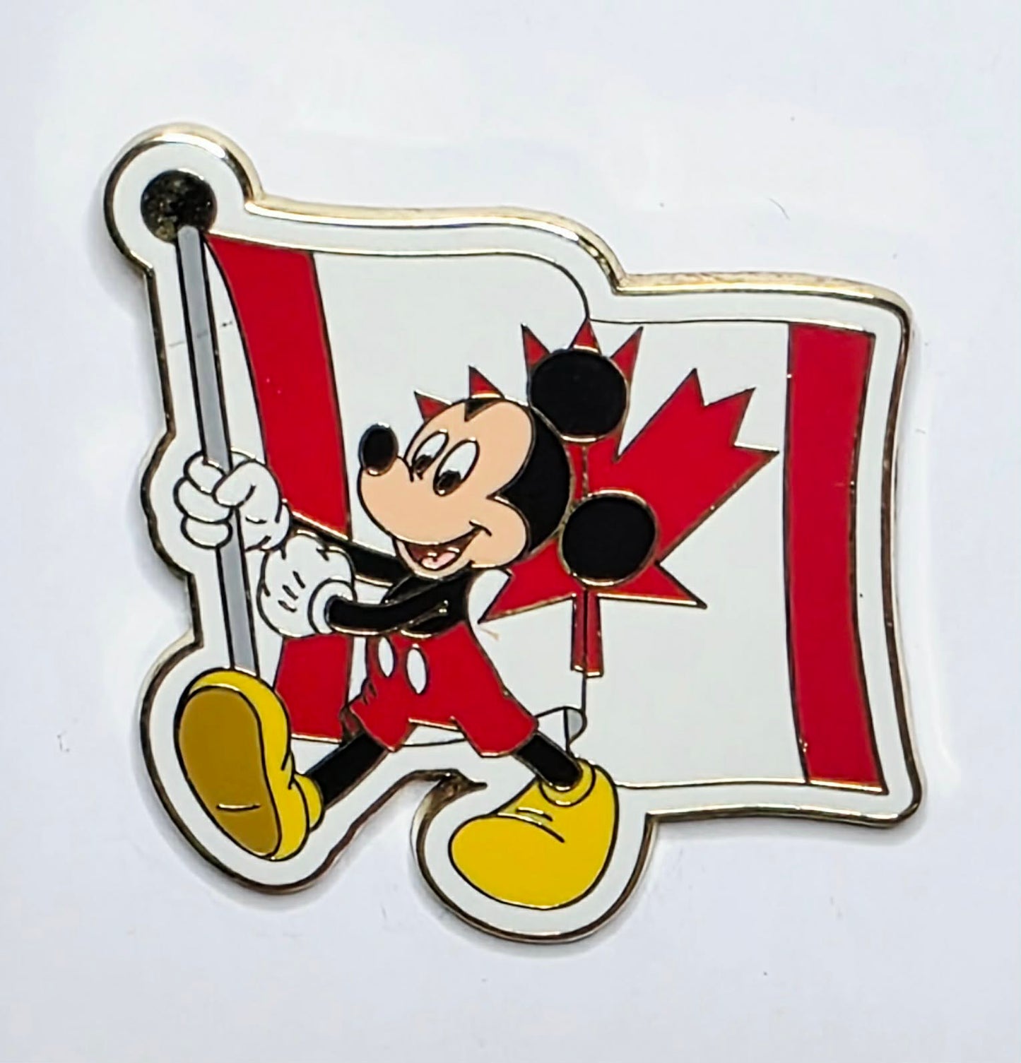 2007 Disney pin featuring Mickey Mouse carrying the Canadian flag.
