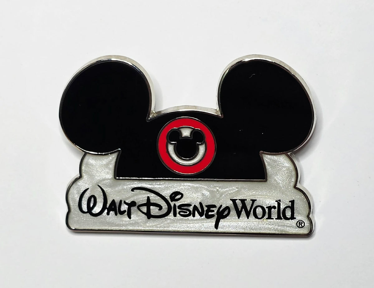 Walt Disney World Mickey Mouse ear hat and logo over a pearlescent cloud