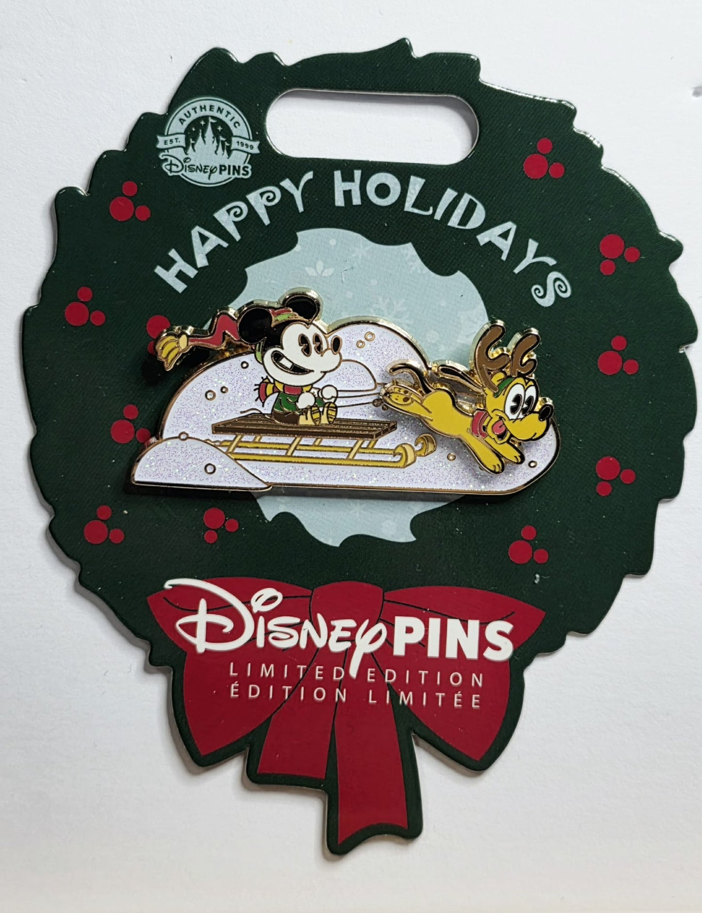 Mickey Mouse and Pluto sledding during Christmas 2023