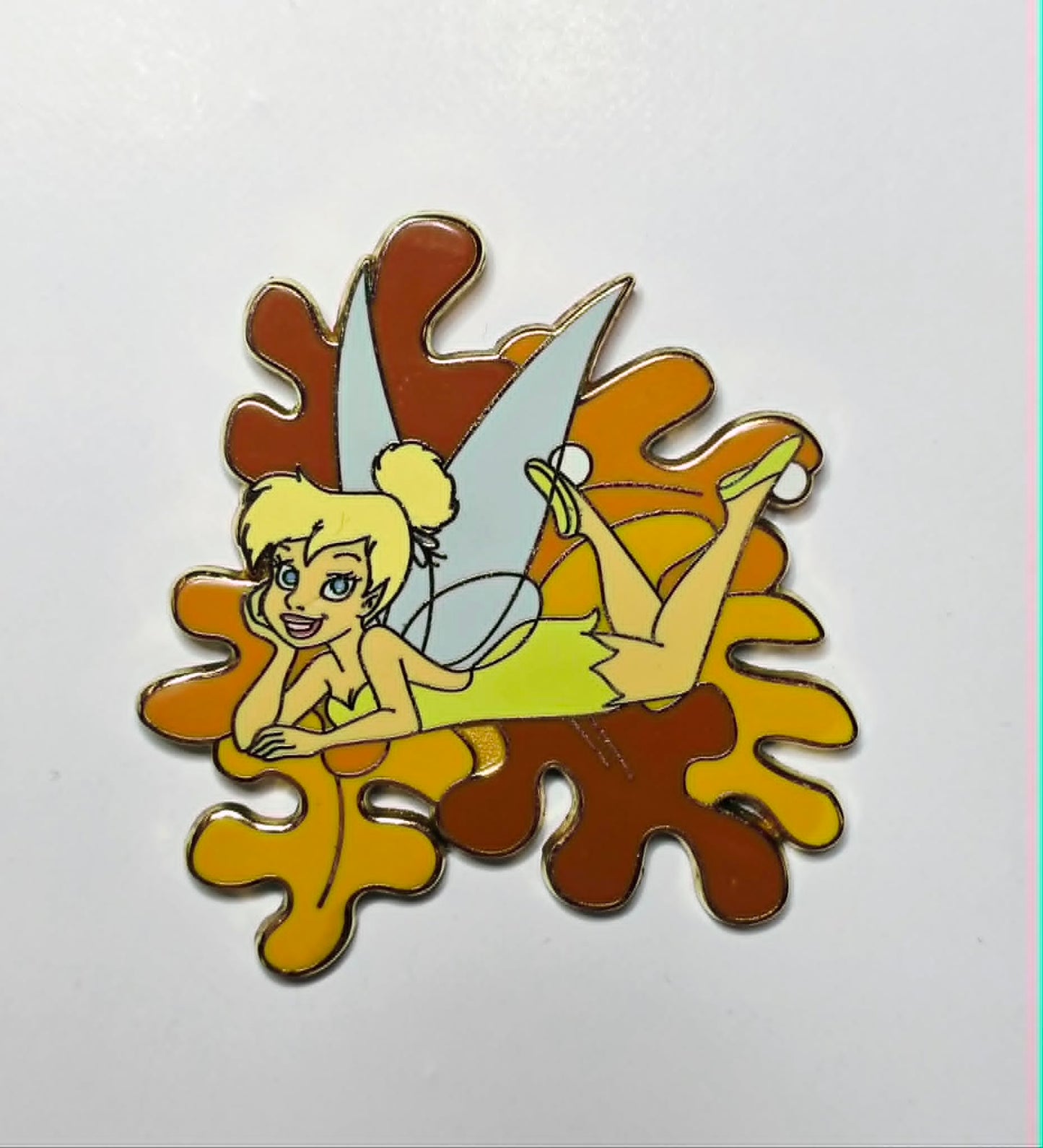 2005 Disney Disneyland Resort Tinker Bell laying down on leaves pin