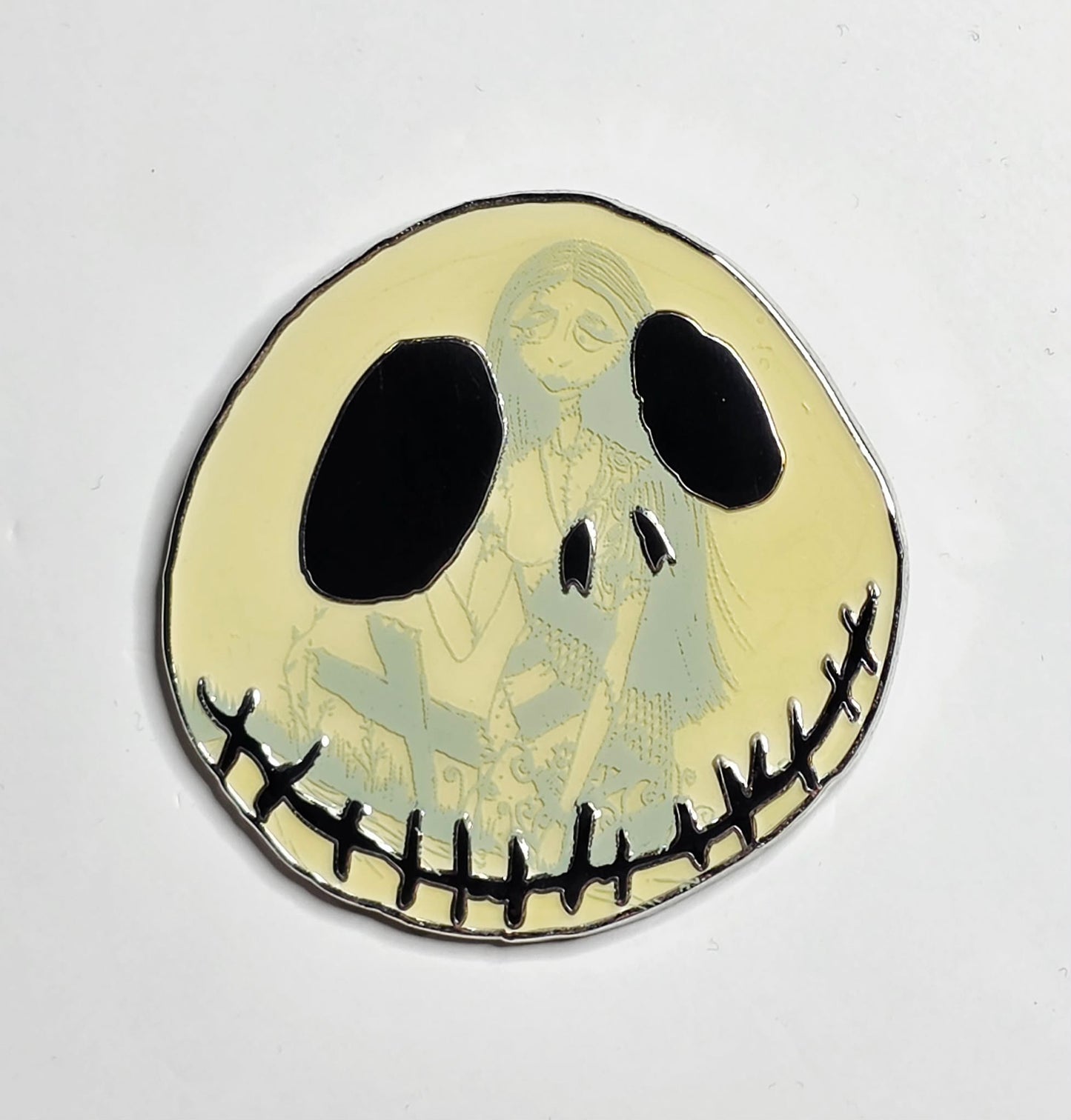 Nightmare Before Christmas Jack Skellington and Sally Glow-in-the-Dark pin.