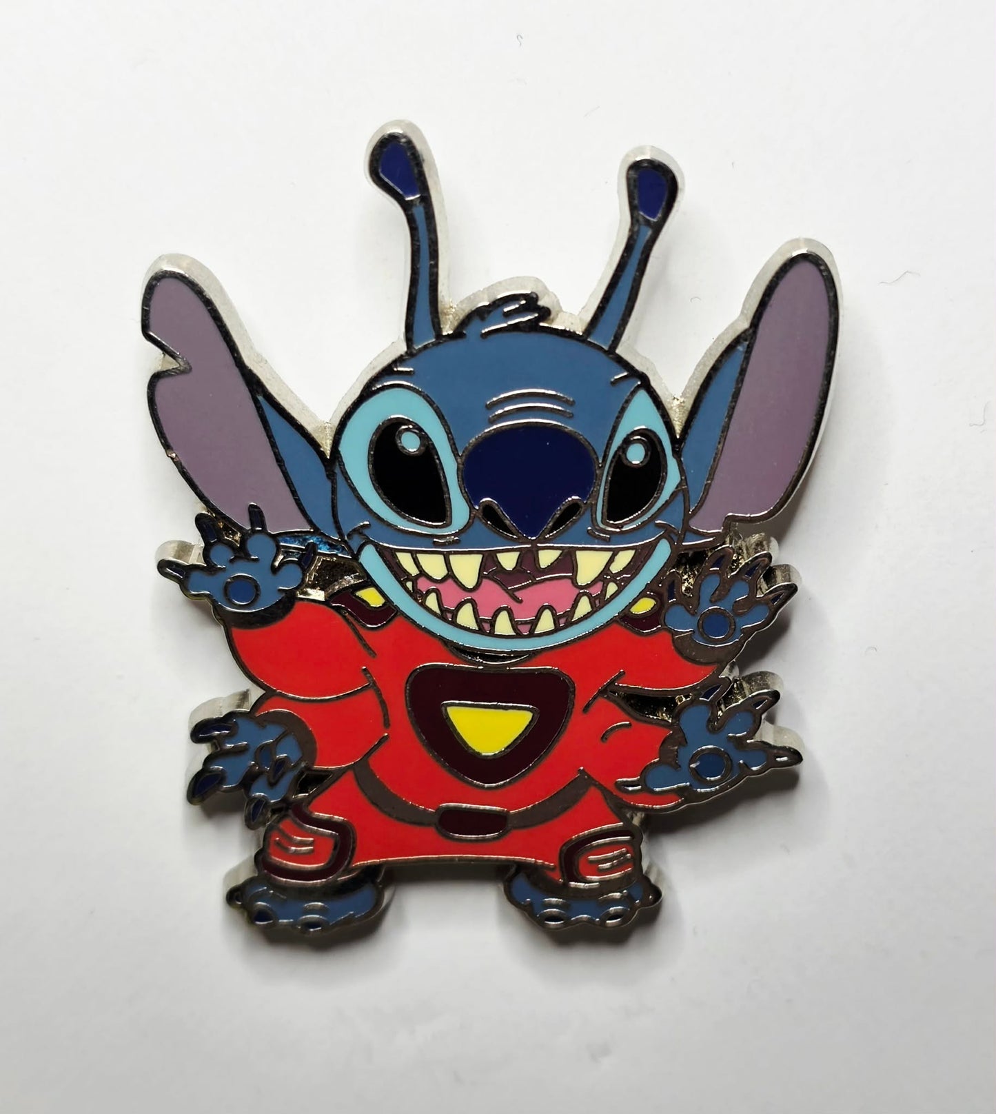 Stitch in his alien form wearing a red space suit