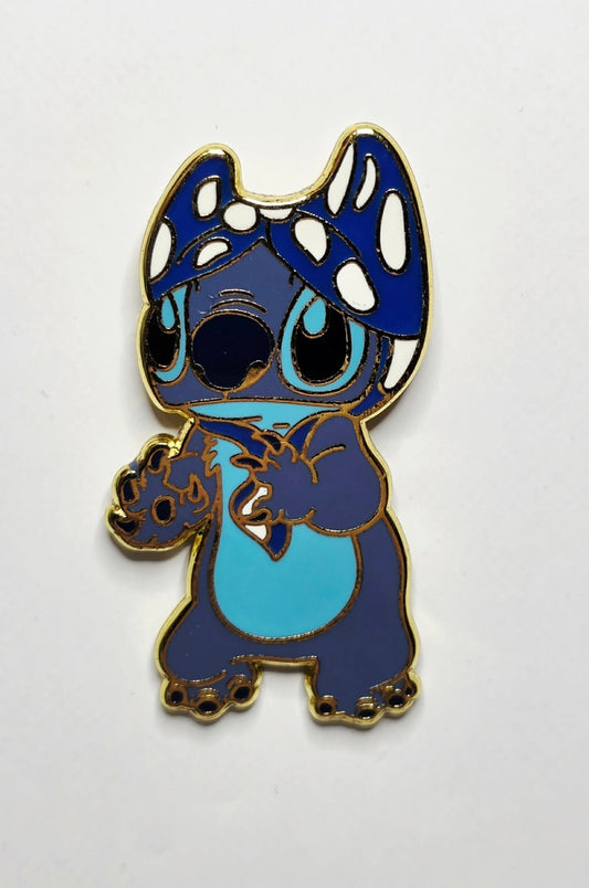 Lilo and Stitch - Stitch wearing a blue and white polka-dotted bikini top as a hat.