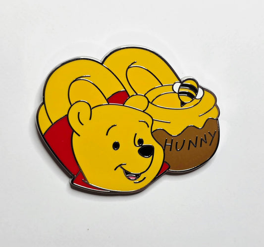 Winnie the Pooh with slippers and a "Hunny" pot.