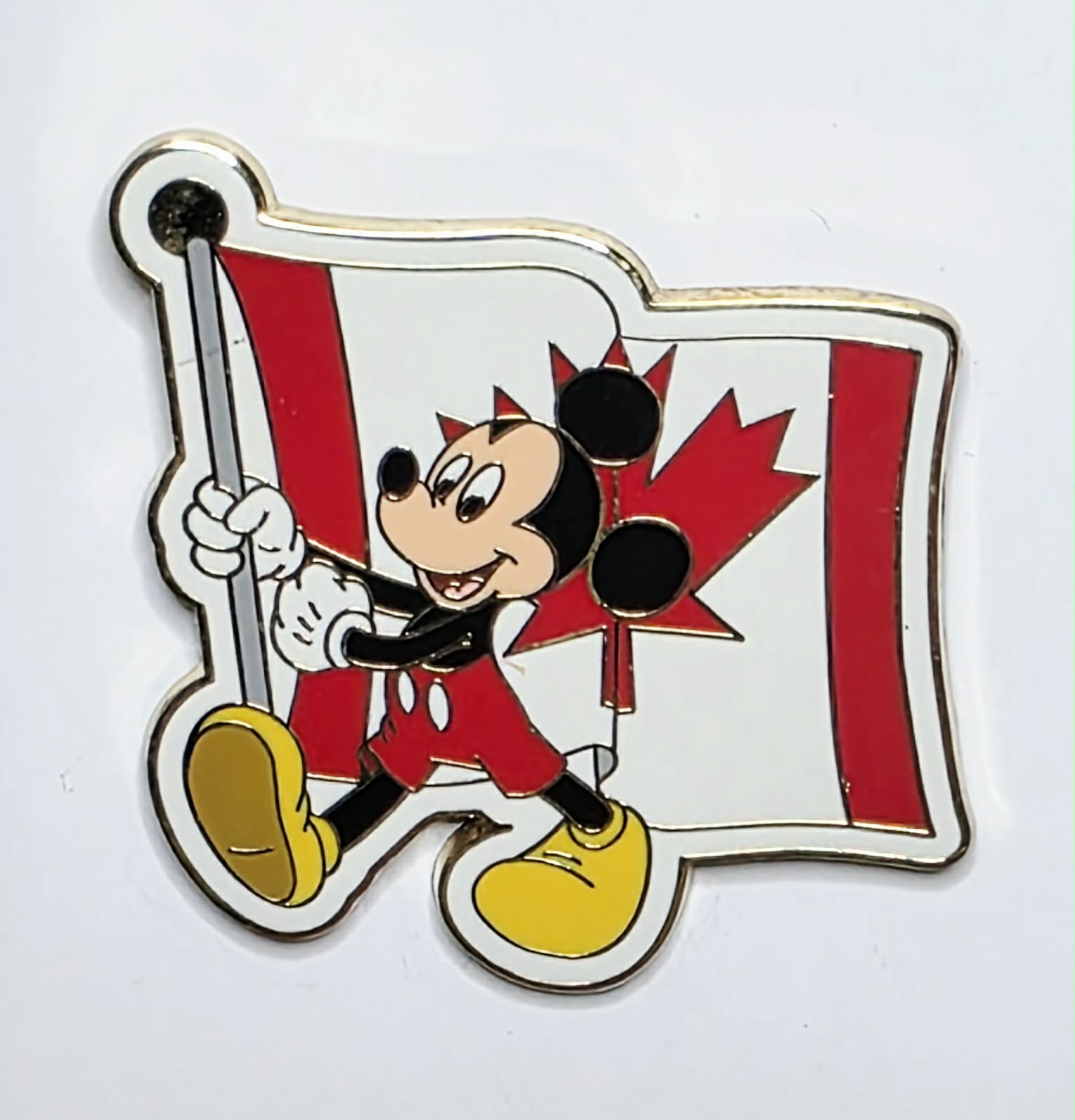 2007 Disney pin featuring Mickey Mouse carrying the Canadian flag ...