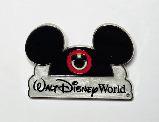Walt Disney World Mickey Mouse ear hat and logo over a pearlescent cloud