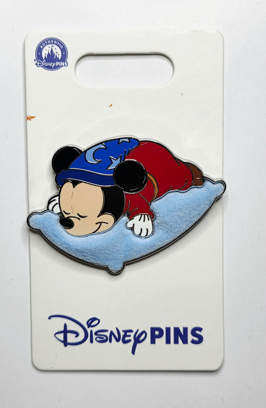 Mickey sleeping on a flocked blue pillow