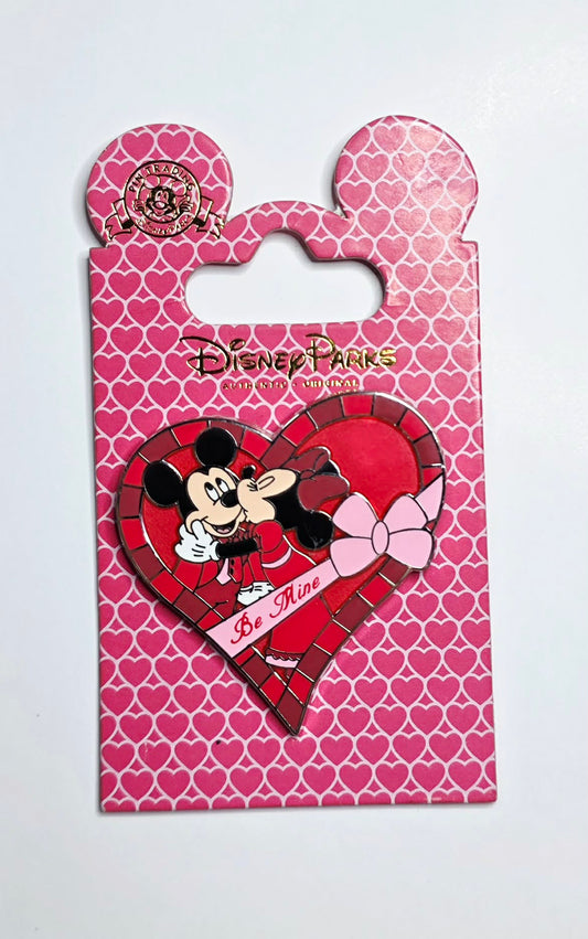 Disney Parks Valentine's Day pin featuring Mickey Mouse and Minnie Mouse sharing a kiss.
