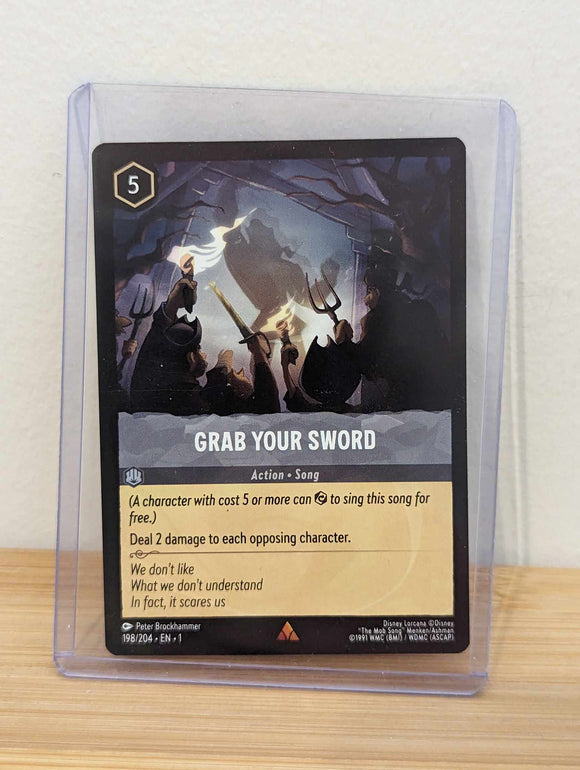 Lorcana Trading Card Game - Grab Your Sword - The First Chapter (1)