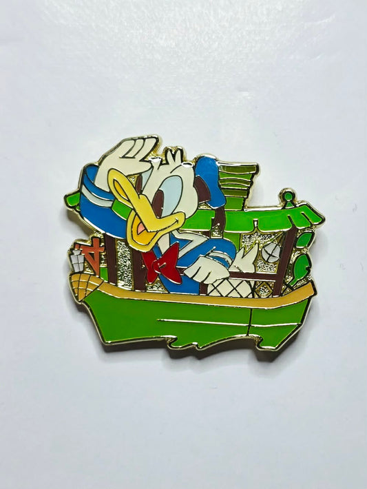 Donald Duck piloting a green Jungle Cruise boat