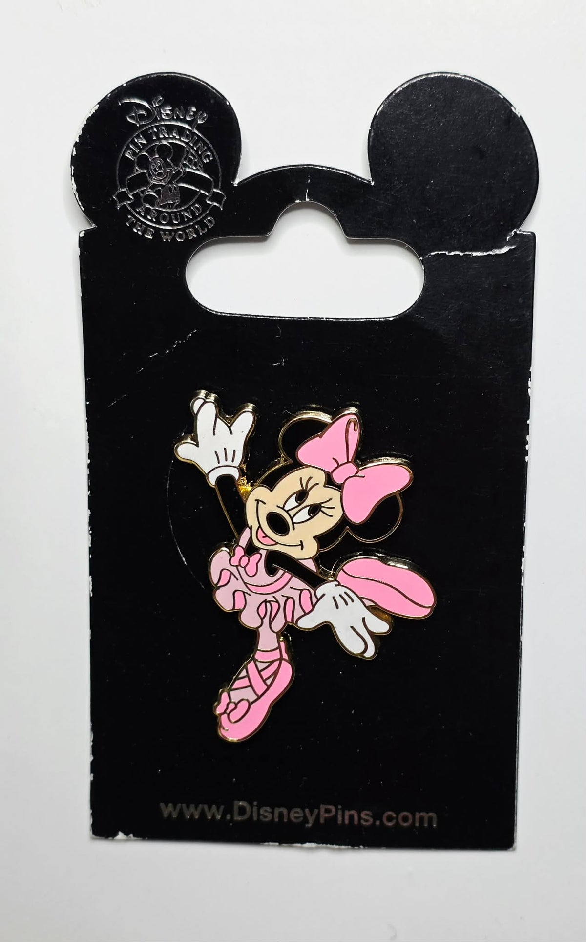 Minnie in a pink tutu and pointe shoe