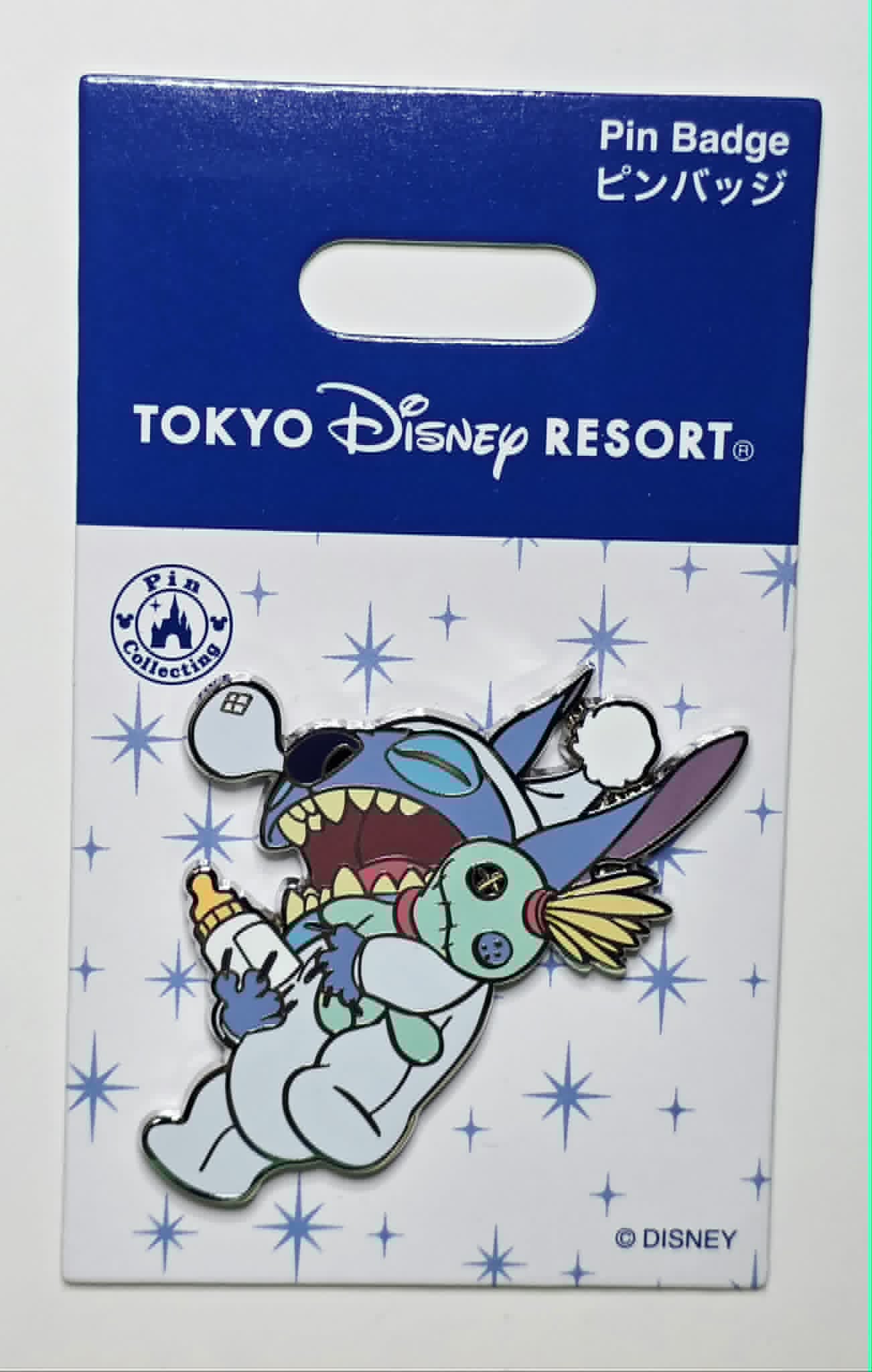 Stitch holding a bottle and the Scrump doll