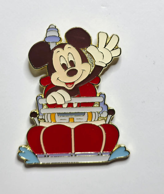 Mickey Mouse riding the Aquatopia attraction at Tokyo DisneySea