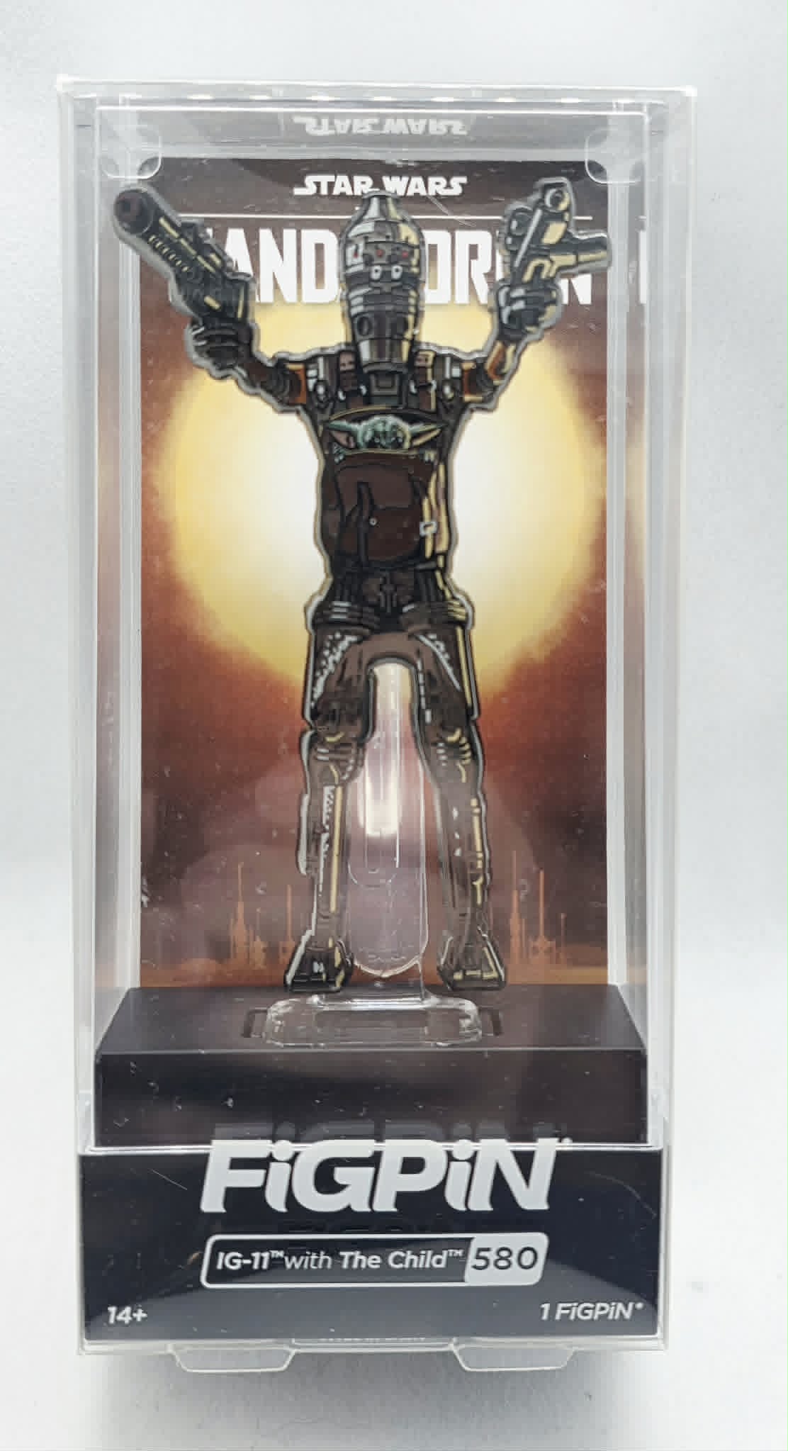 Star Wars The MandalorianIG-11 holding The Child (Grogu)