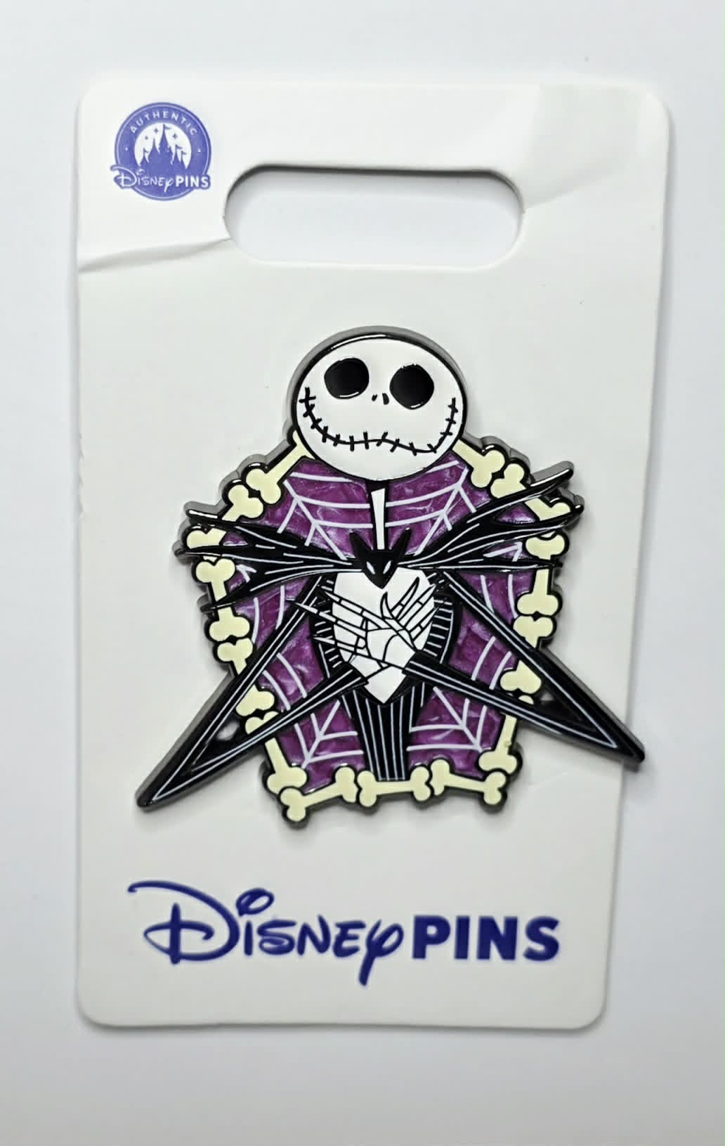NBC - Jack Skellington framed by a purple spider web and twisted bones.