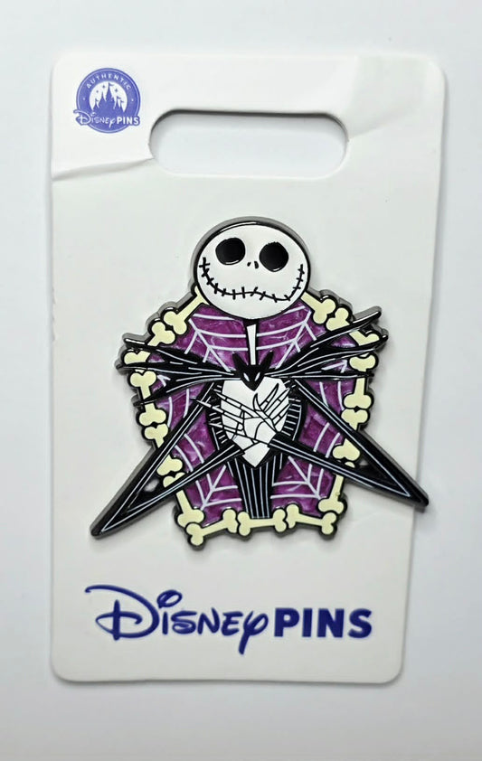 NBC - Jack Skellington framed by a purple spider web and twisted bones.