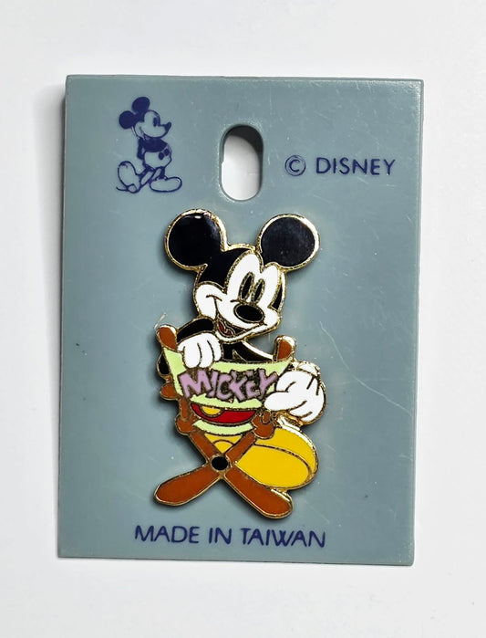 Mickey Mouse sitting in a director's chair