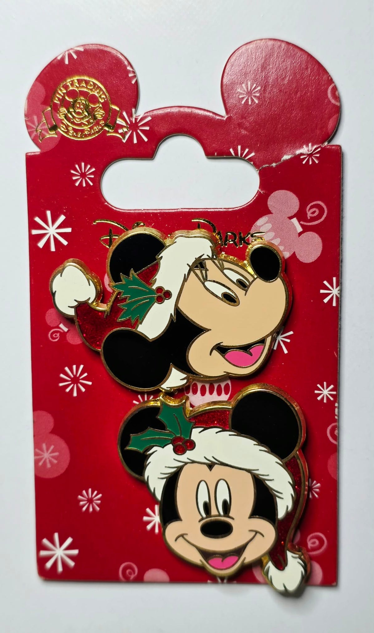 Mickey Mouse and Minnie Mouse in festive Santa hats