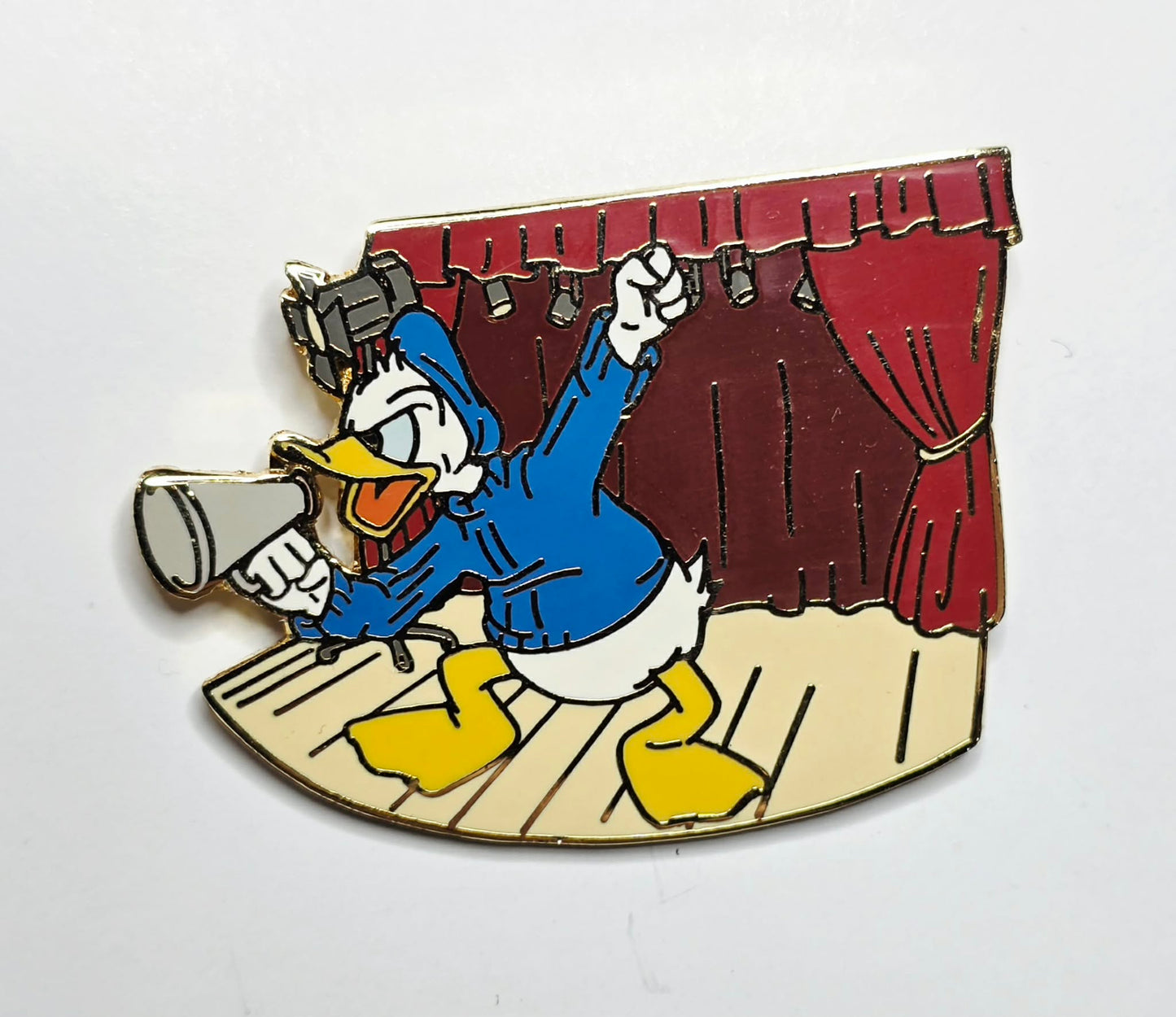 Donald Duck -  theater stage holding a megaphone