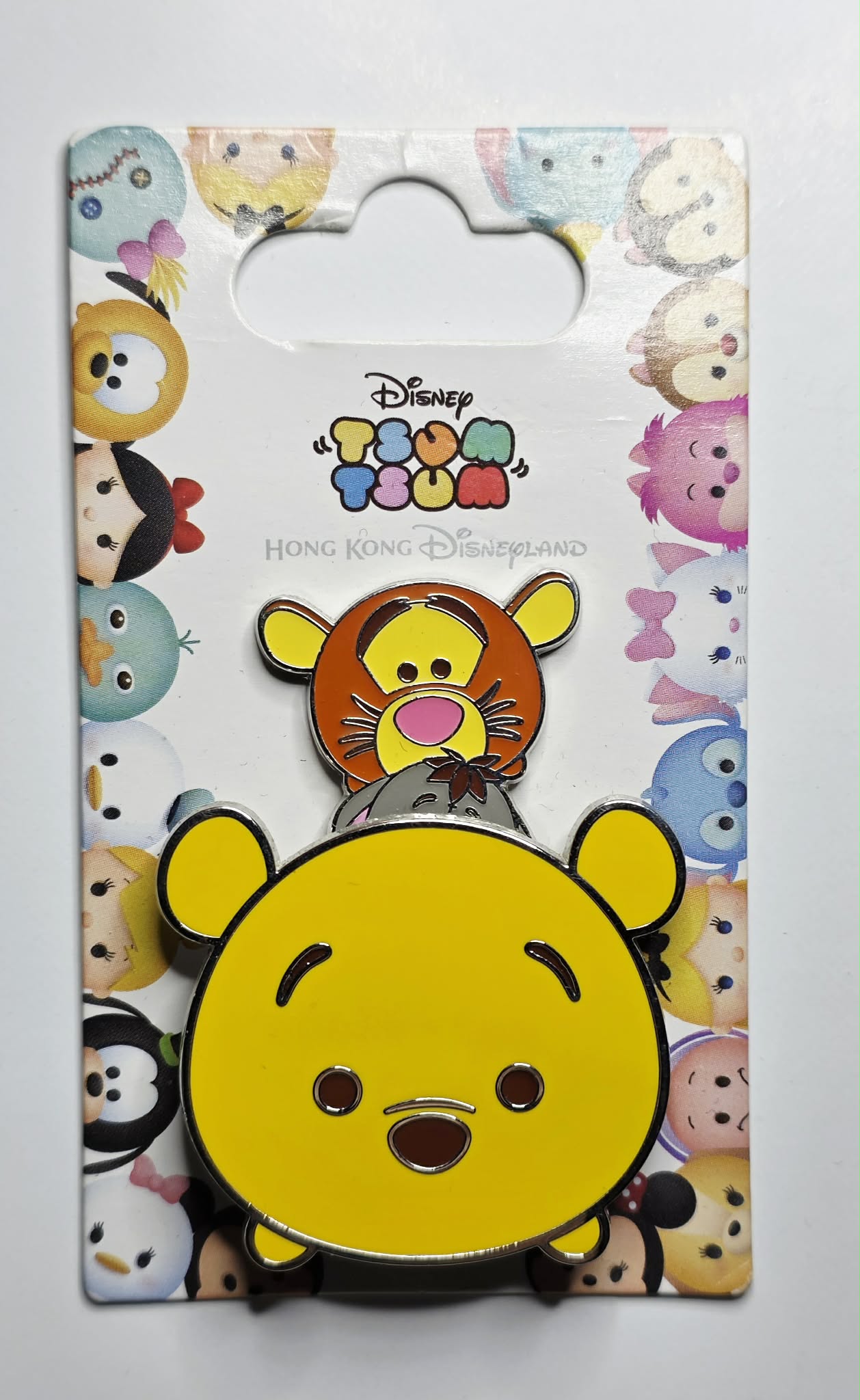 Winnie the Pooh, Piglet, Eeyore, and Tigger stacked together in a "Tsum Tsum"
