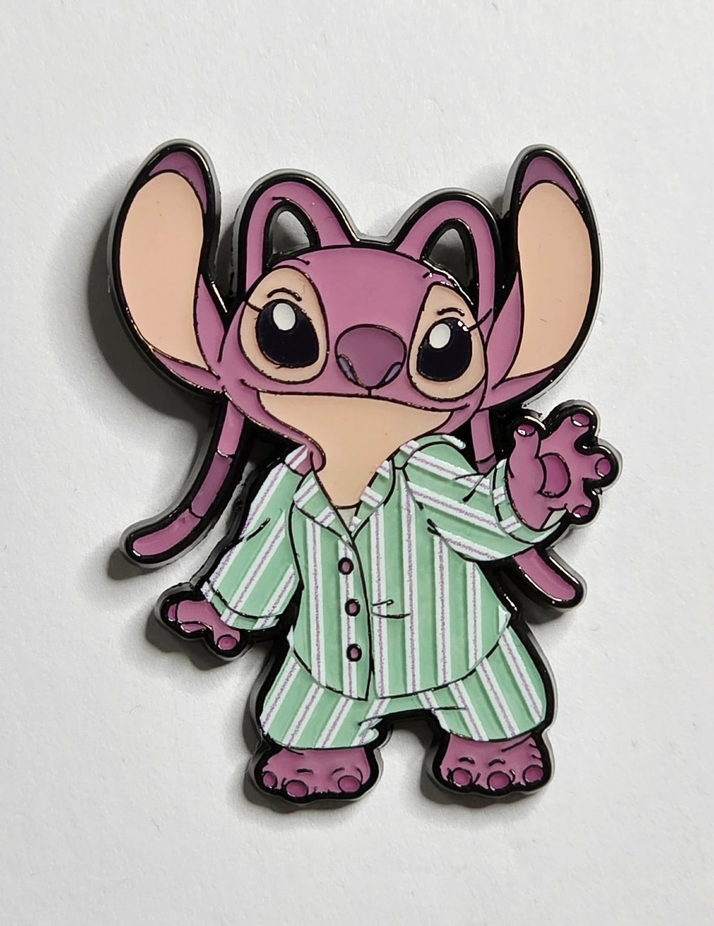 Stitch & Angel Bedtime Blind Box pin of the character Angel in pajamas.