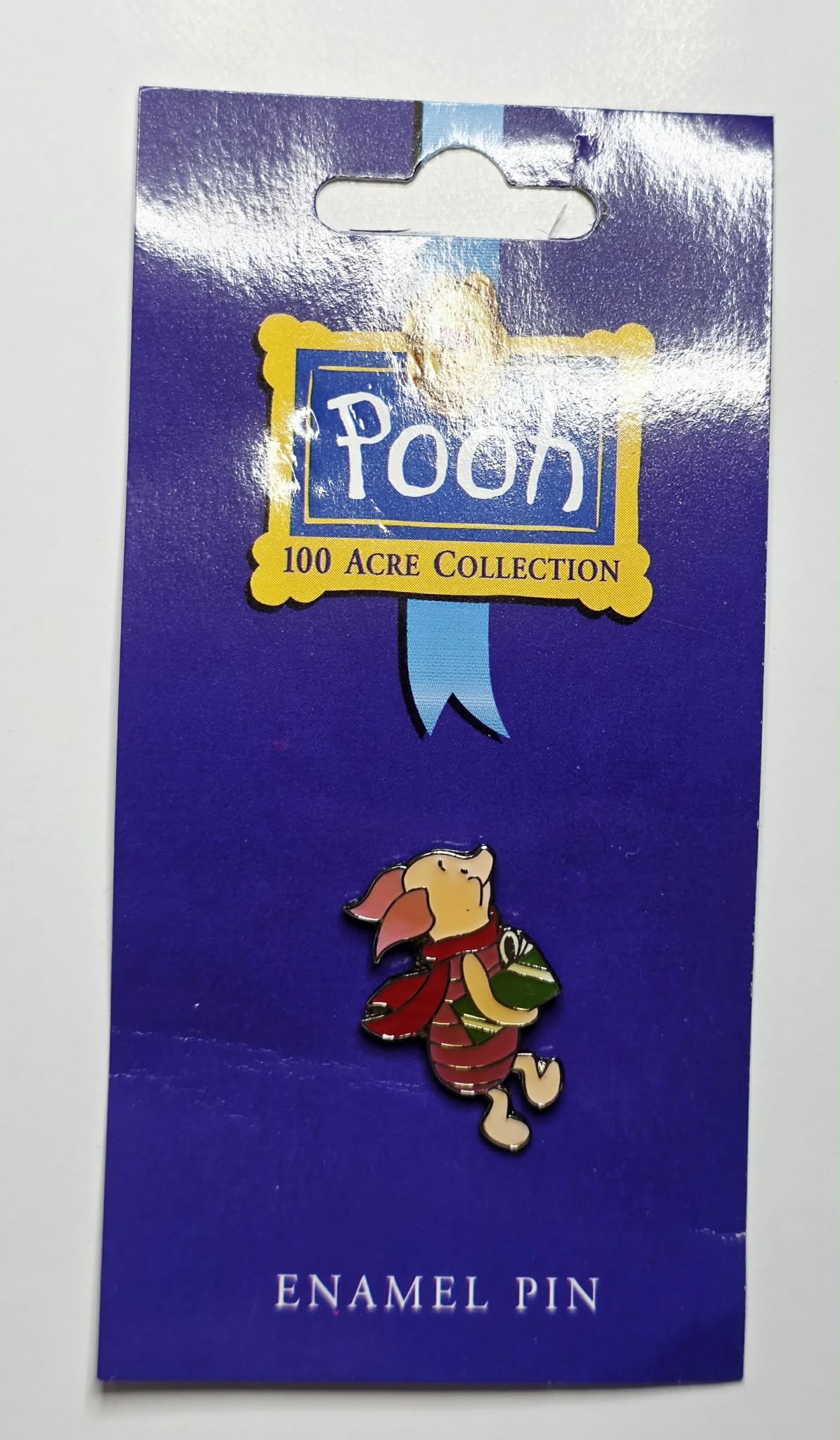 Winnie the Pooh - Piglet carrying a green Christmas gift