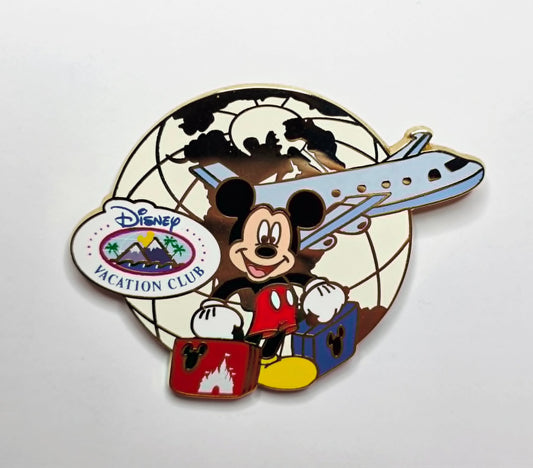 Mickey Mouse - traveling with luggage and a jet airplane.
