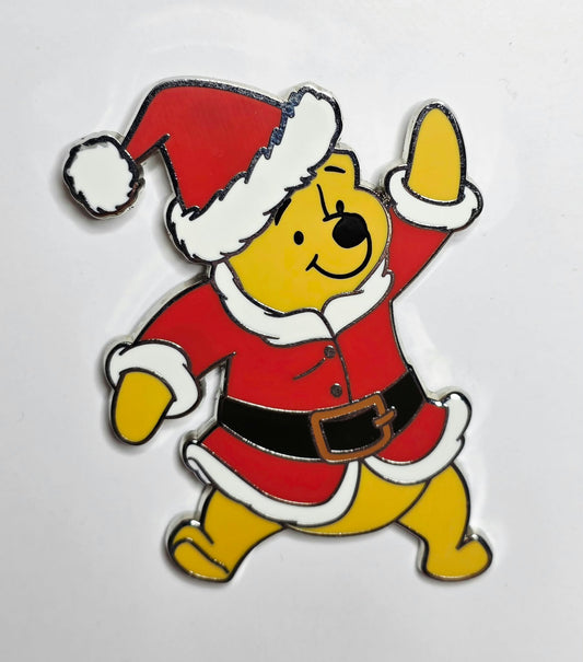 Winnie the Pooh dressed in a Santa Claus suit